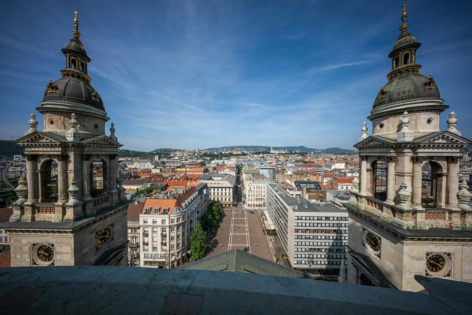 View west from the Panorama Terrace of St. Stephen's Basilica, between the two bell towers, over the square and along Zrínyi utca towards the Buda Hills