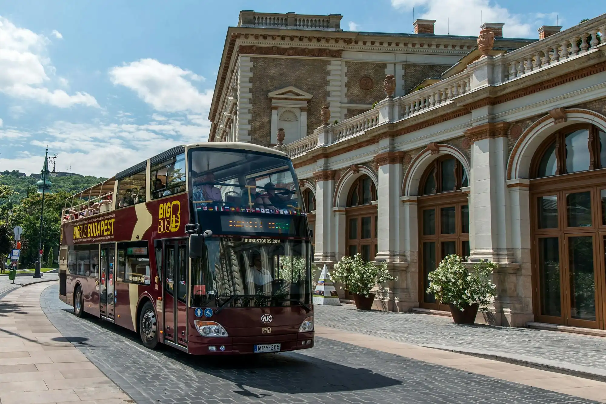 A Big Bus double-decker at the Castle Garden Bazaar below Buda Castle