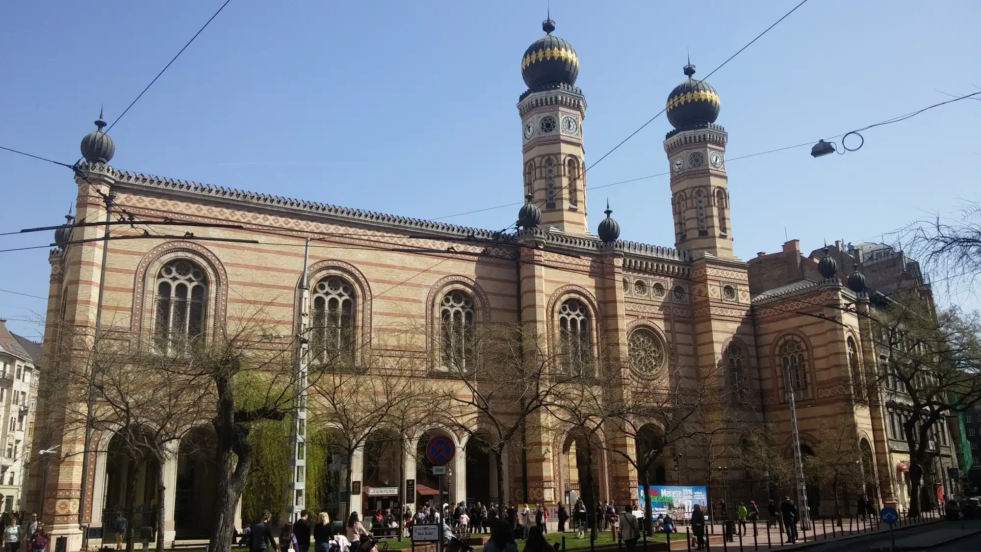 The Dohány Street Synagogue seen from the Károly körút side, with the arcaded museum wing on the left and the two towers behind