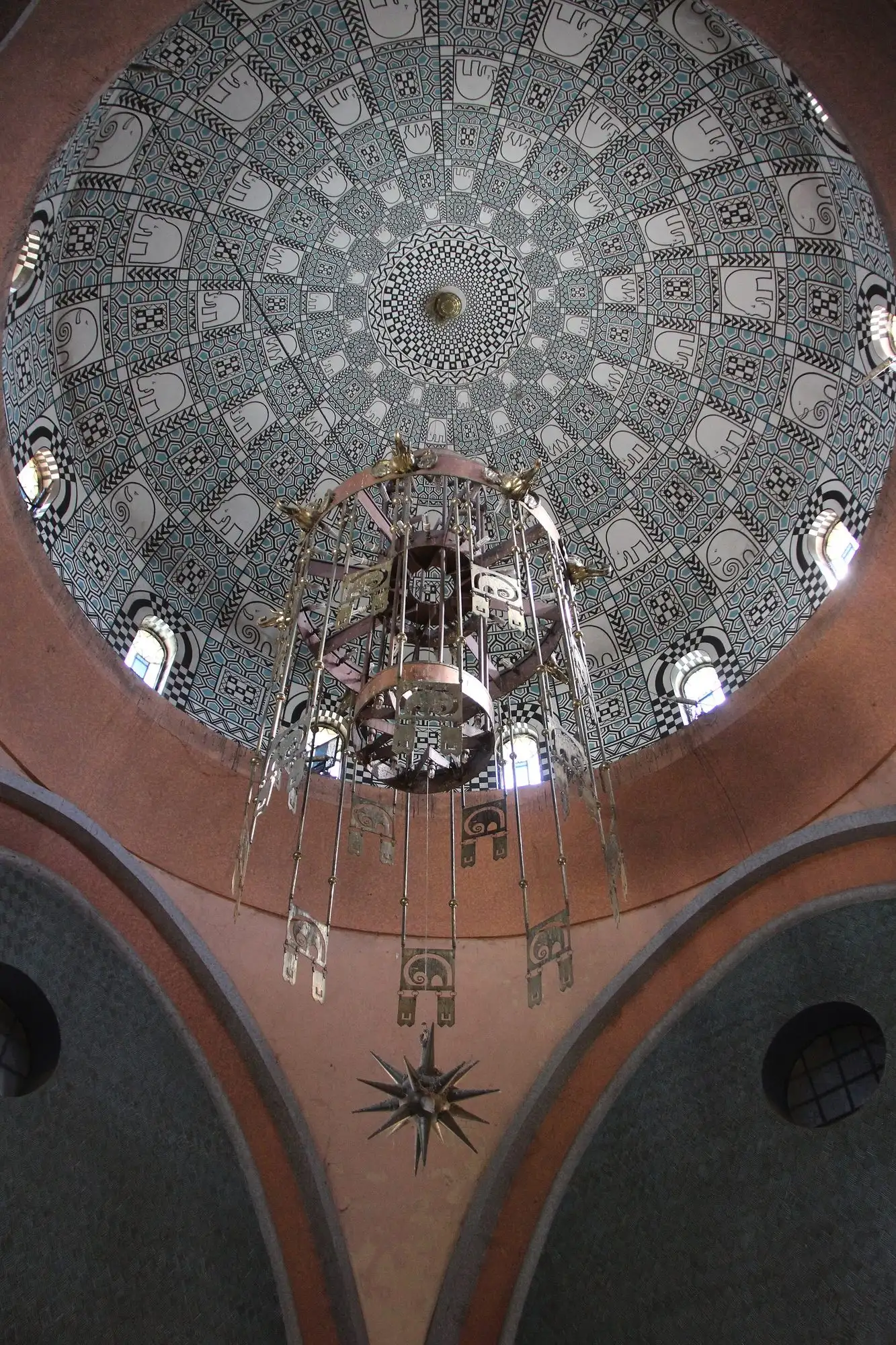 The tiled dome and hanging lamp inside the Elephant House at Budapest Zoo
