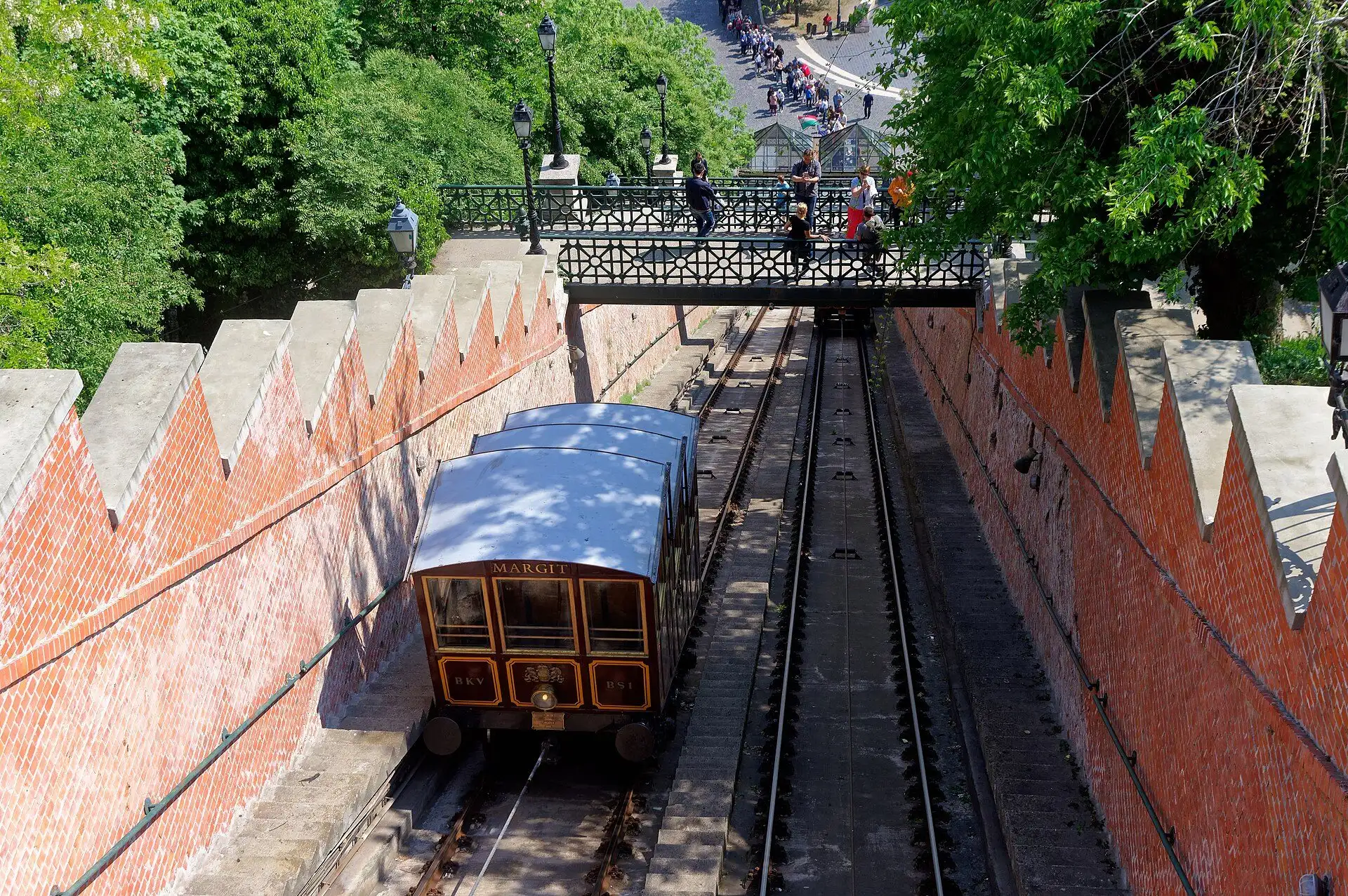 A car of the Buda Castle Funicular climbing the brick-walled track towards Szent György tér