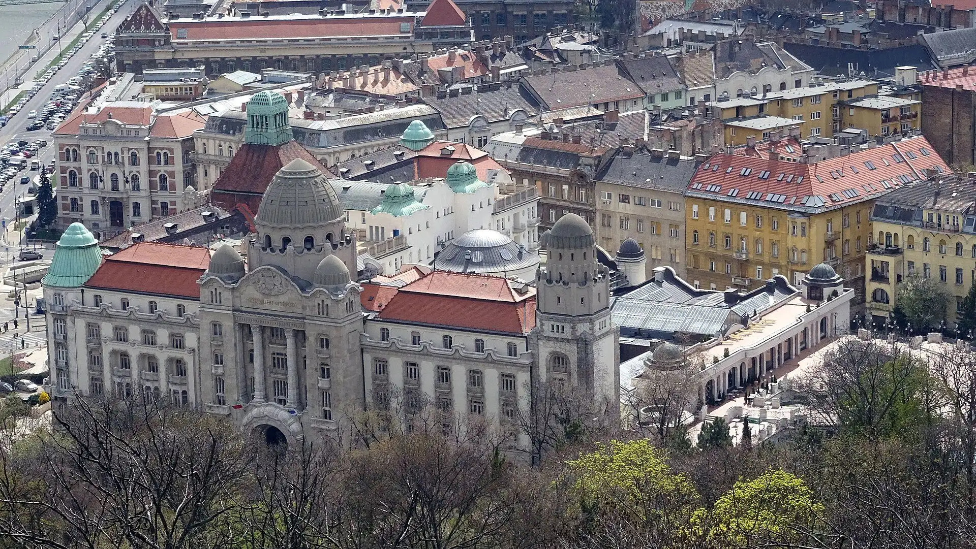 The Gellért Hotel and the bath behind it seen from above on Gellért Hill, with the roofs of Buda beyond