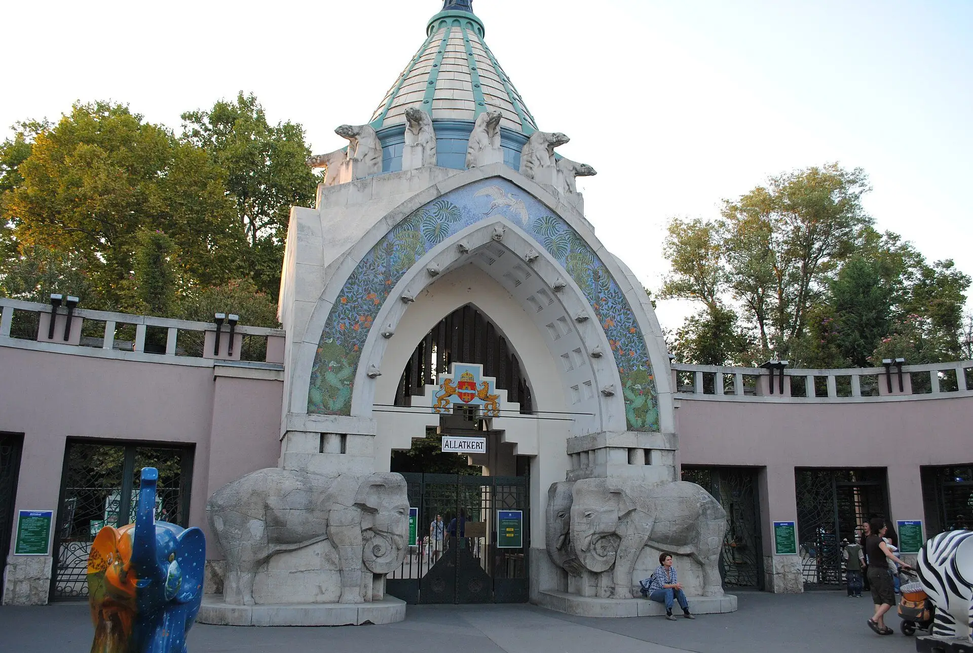 The Art Nouveau Main Gate of Budapest Zoo, with its conical tower, stone animals and carved elephants beside the arch