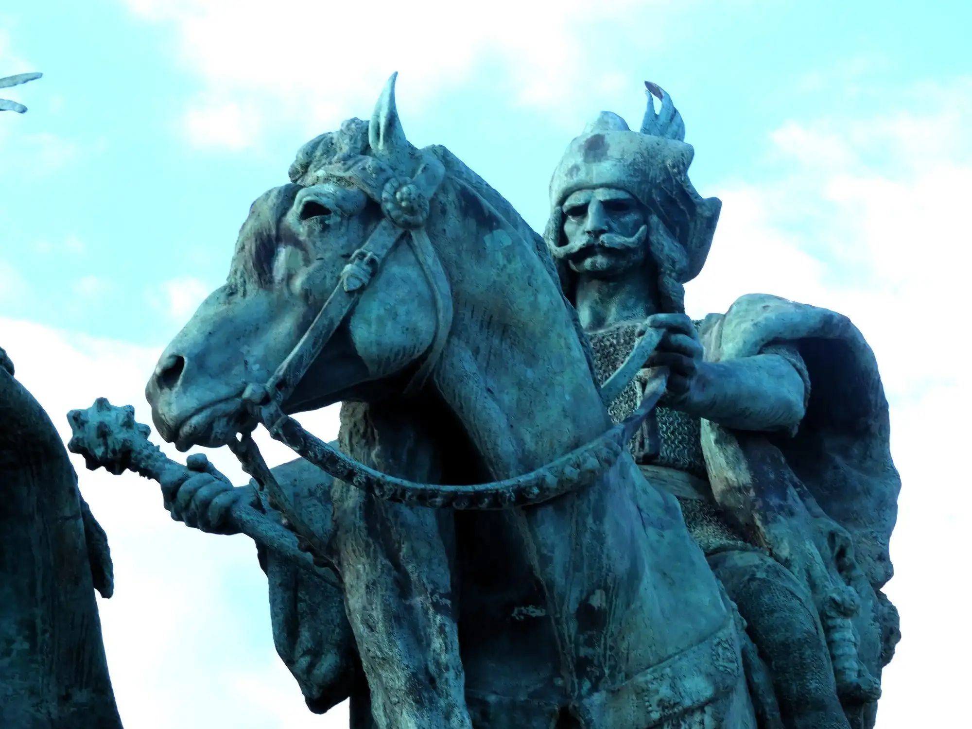 Close view of one of the seven Magyar chieftains on horseback at the foot of the Millennium Monument, in a horned helmet and mail