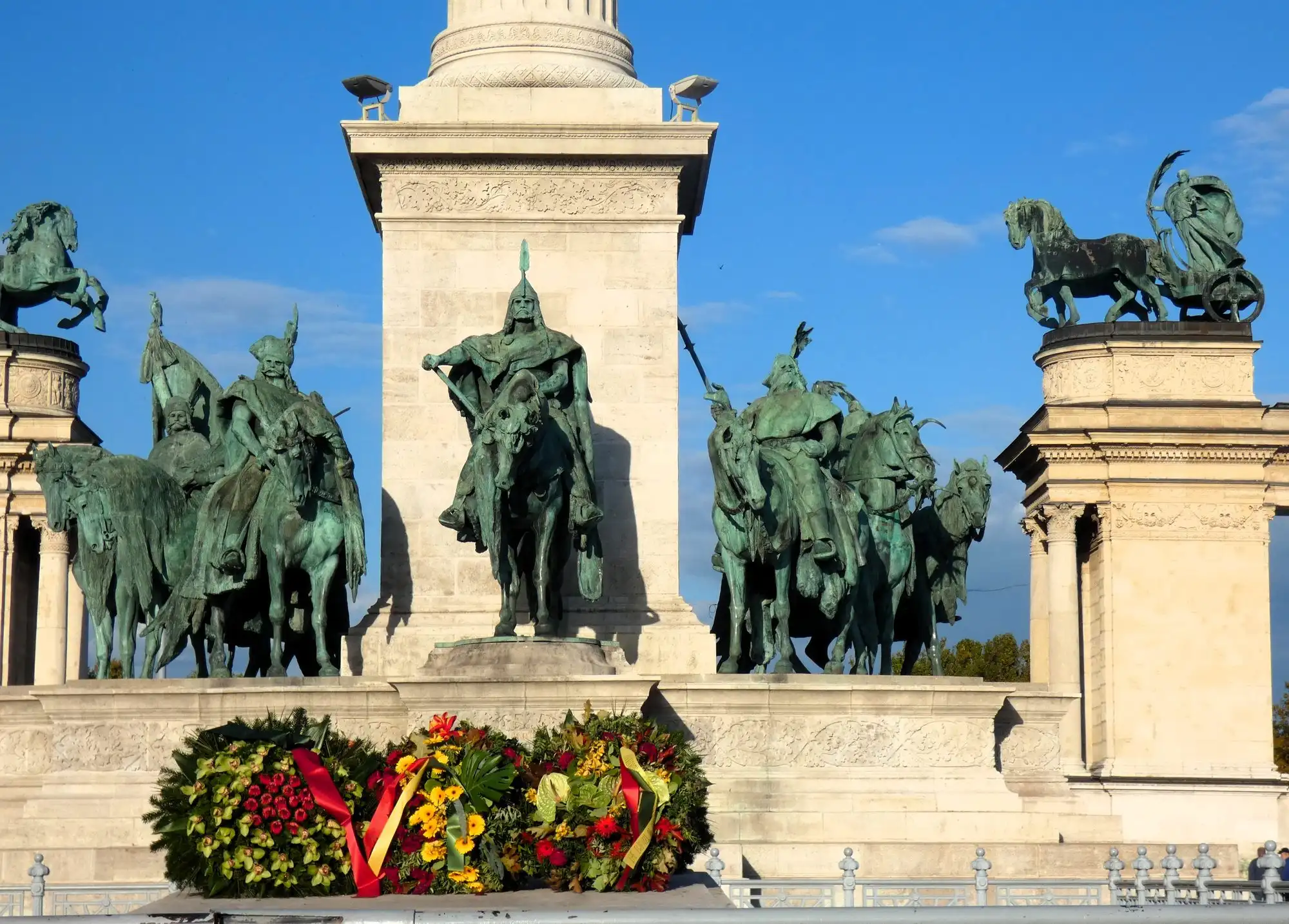 Wreaths laid at the foot of the Millennium Monument on Heroes' Square, below the bronze statues of Prince Árpád and the Magyar chieftains
