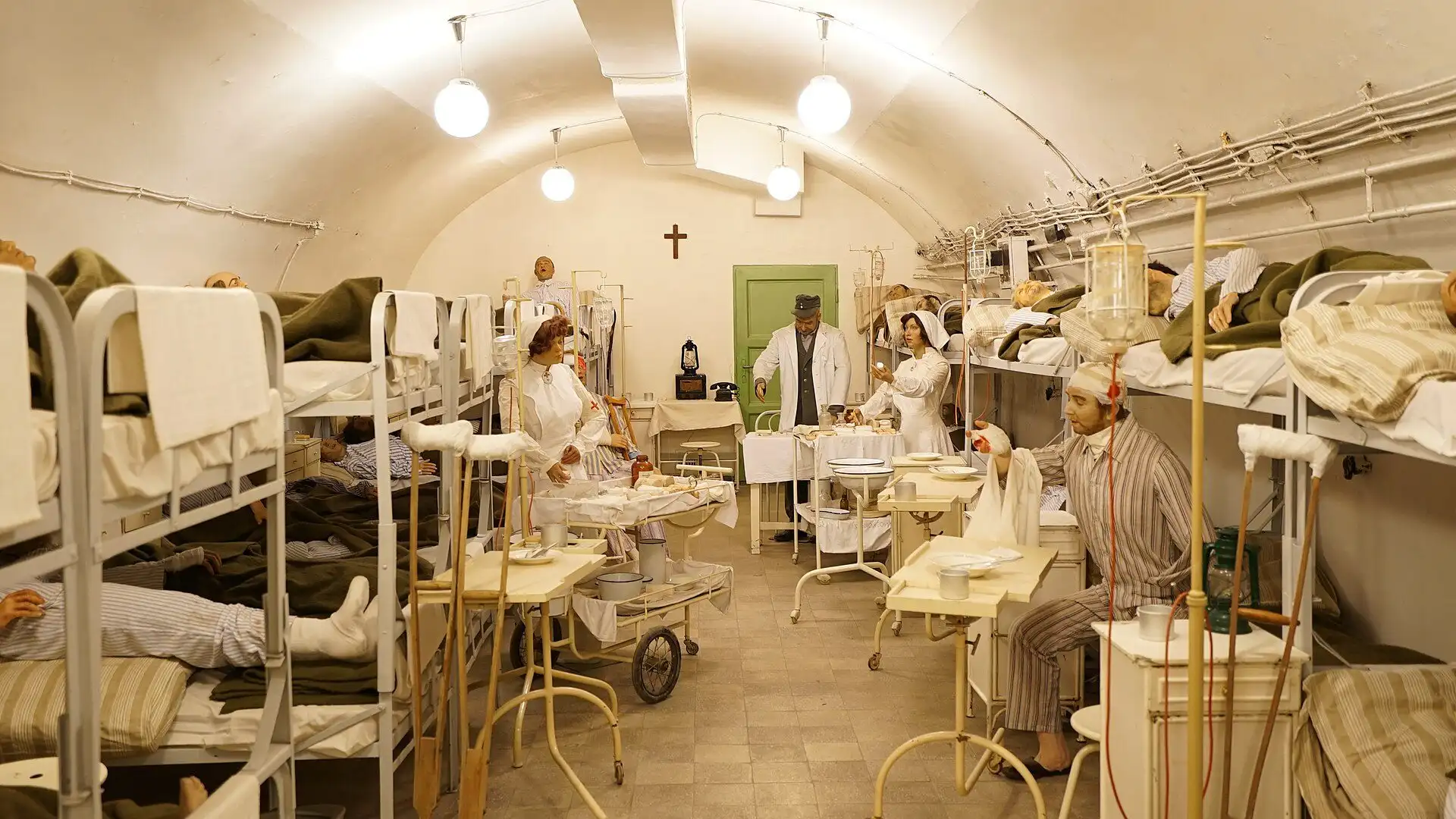 A reconstructed ward of the Hospital in the Rock under Buda Castle Hill, with hospital beds and wax figures of patients and nurses