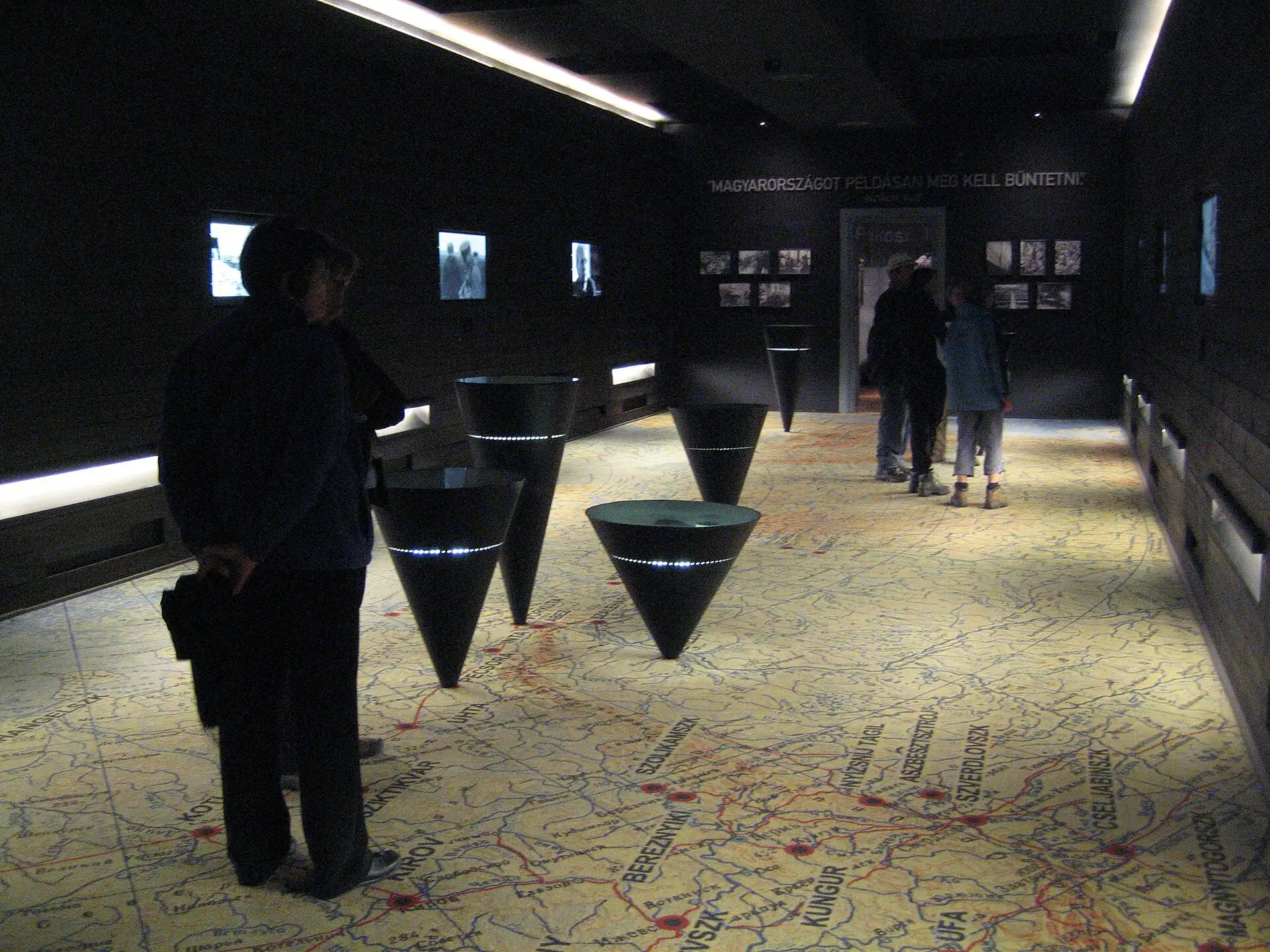 The Gulag room on the second floor of the House of Terror Museum, its floor a map of the Soviet Union with black cones hanging above it