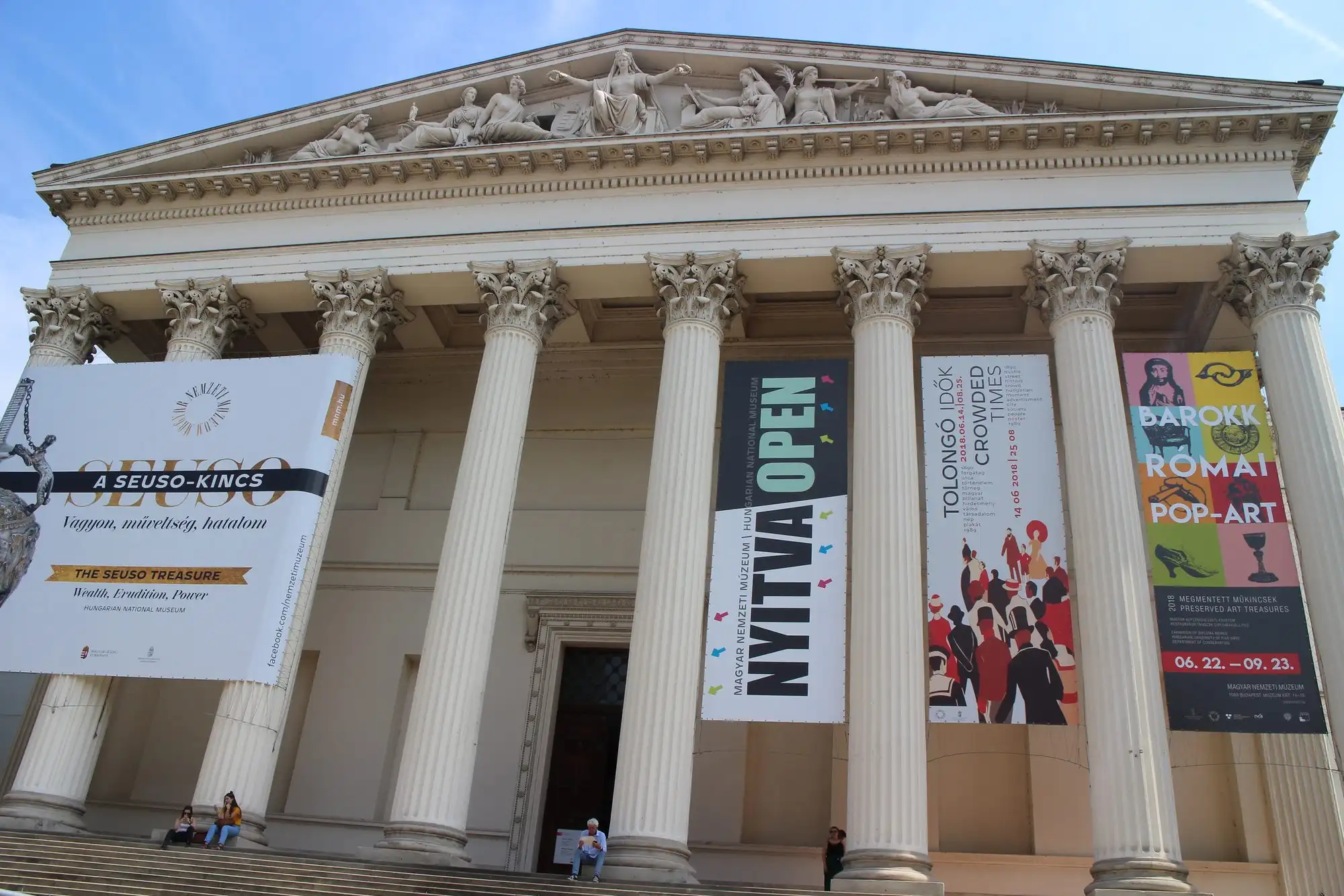 The columned portico of the Hungarian National Museum in Budapest, hung with exhibition banners
