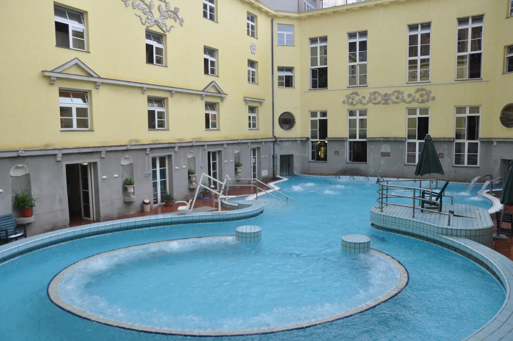 Courtyard adventure pool with a round whirlpool at Lukács Thermal Bath, Budapest