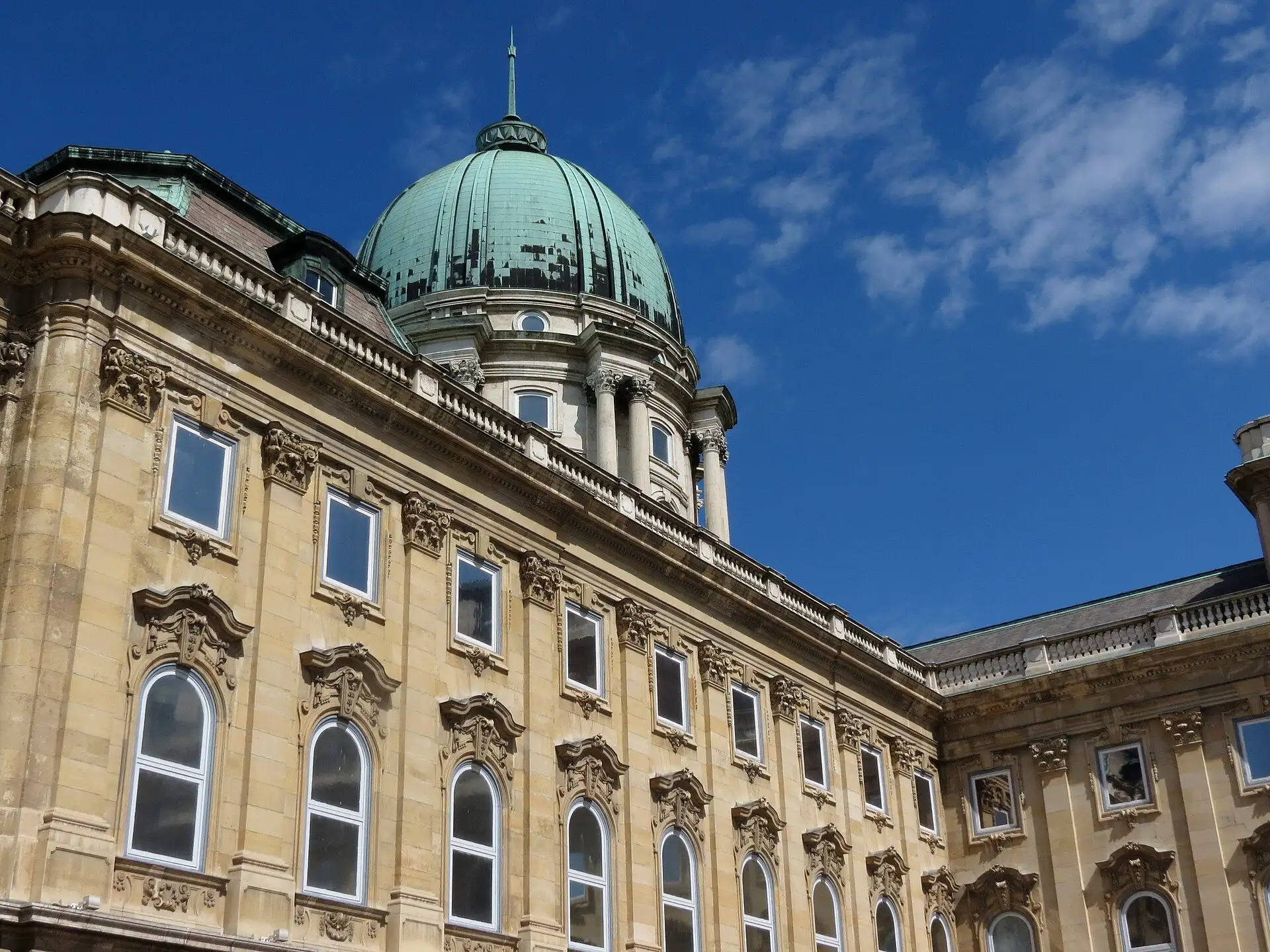 The green dome of Buda Castle's Royal Palace above the Hungarian National Gallery's wing, seen from the courtyard