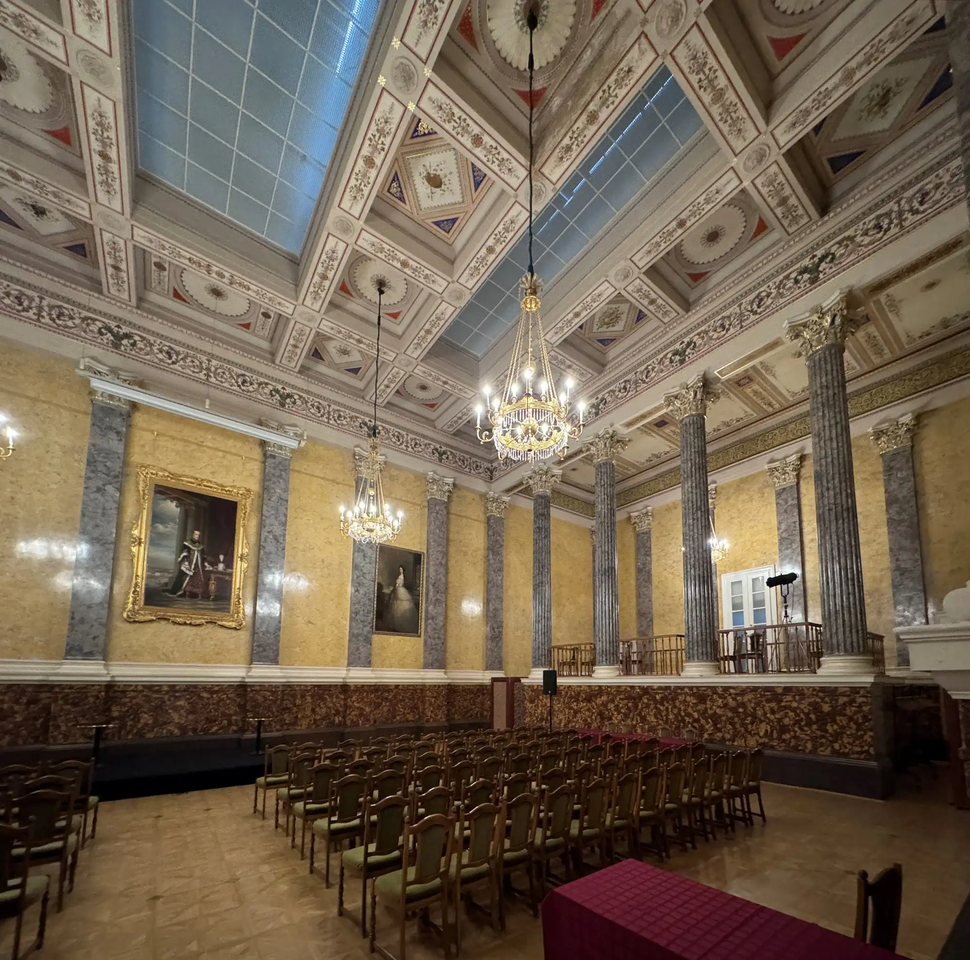 The Ceremonial Hall of the Hungarian National Museum, laid out with rows of chairs beneath its painted ceiling