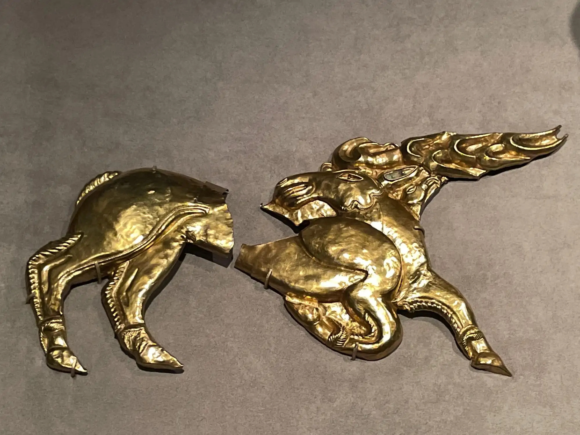 Scythian gold stag shield ornaments on display at the Hungarian National Museum