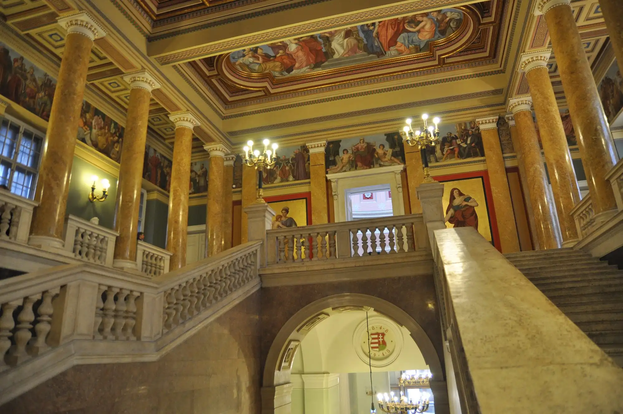 The grand staircase of the Hungarian National Museum, with Károly Lotz and Mór Than's frescoes on the walls and ceiling