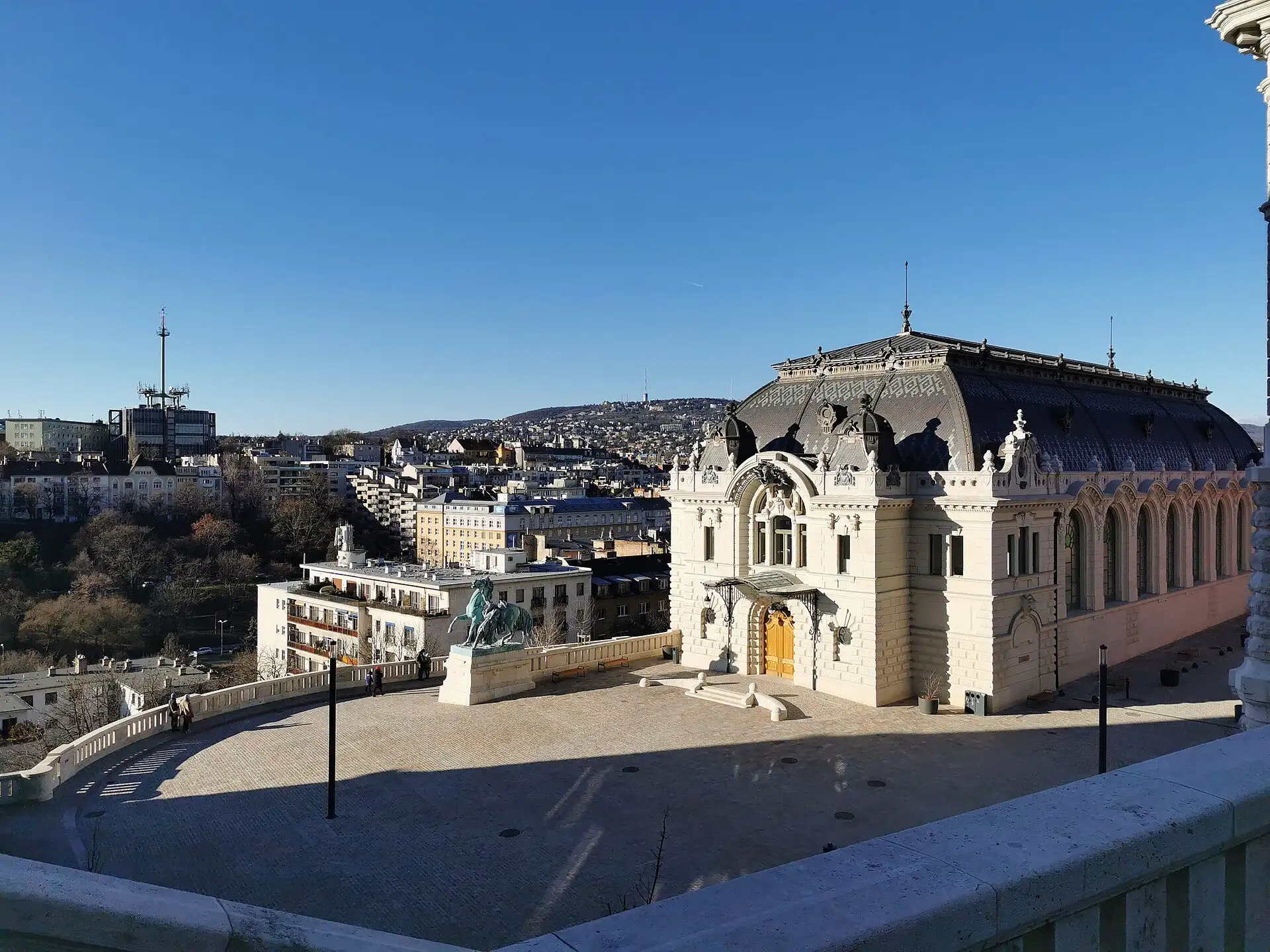 The rebuilt Riding Hall of Buda Castle seen from above, with the Csikós horse-herd statue in the courtyard in front of it