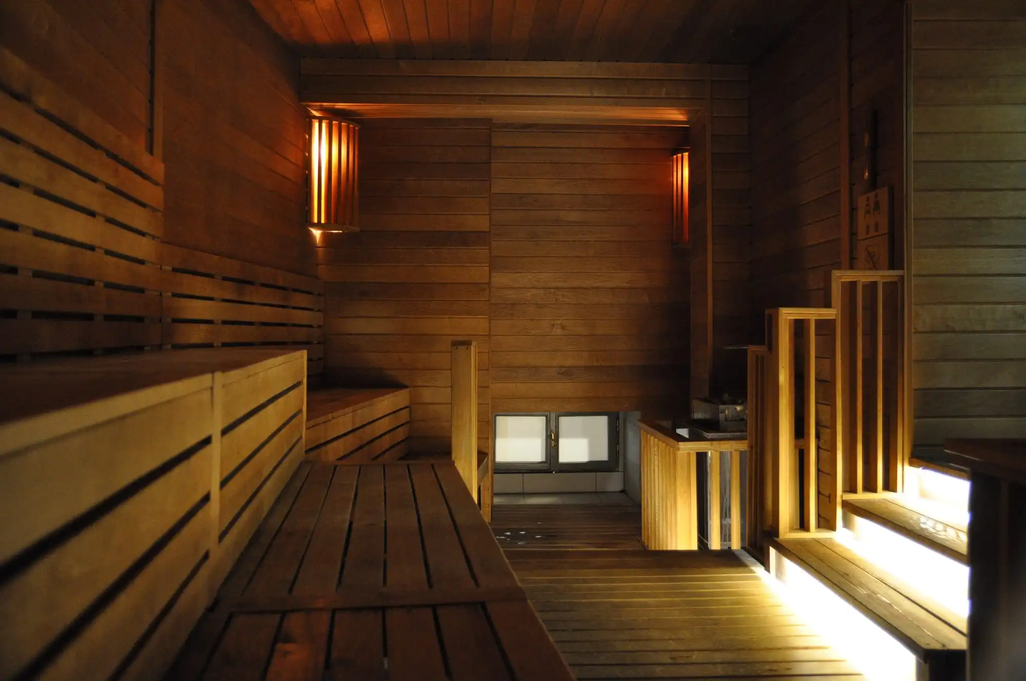 Wooden benches and lamps in a Finnish sauna in the sauna world at Rudas Thermal Bath