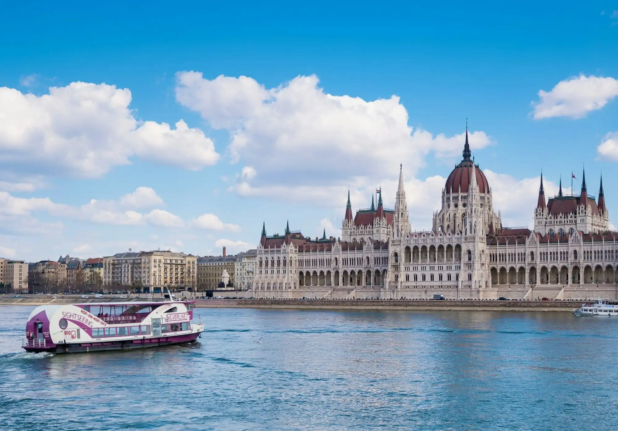 A Silverline sightseeing boat on the Danube in front of the Hungarian Parliament
