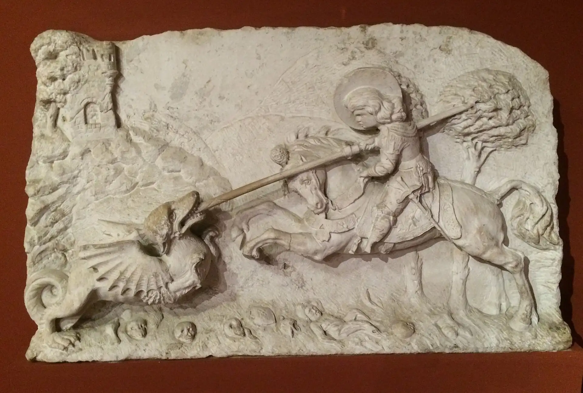 A carved stone relief of Saint George and the dragon from the early 1500s, found in the Castle quarter and displayed at the Budapest History Museum