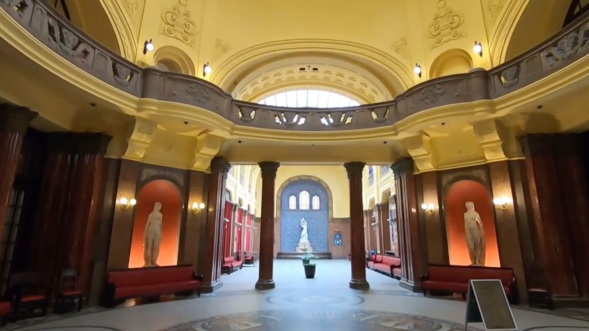 Grand hall of Gellért Thermal Bath with statues and ornate details